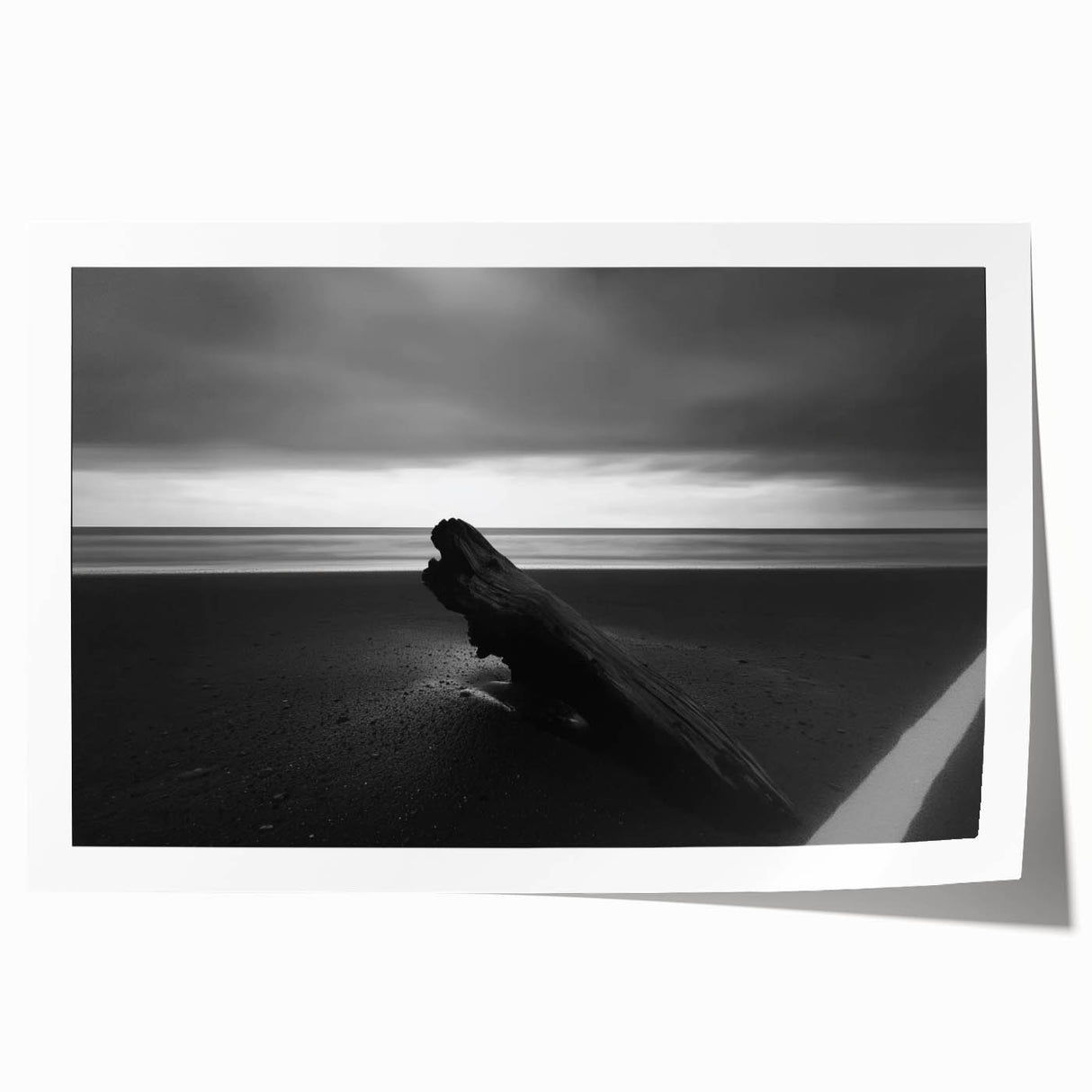 Vibrant rolled print showcasing a serene beach landscape with soft waves and a clear blue sky, packaged securely in a protective cardboard tube for easy shipping.