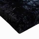 Close-up of a stretched canvas artwork depicting a serene landscape with a bridge, showcasing vibrant colors and intricate details. Perfect for home decor enhancement.