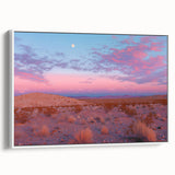 Framed canvas artwork depicting a serene desert landscape with soft beige and orange hues, showcased in a sleek white frame, ideal for contemporary home decor.