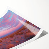 Desert landscape rolled print showcasing vivid sunset hues of orange and purple, featuring textured details and a durable cardboard tube for safe shipping.