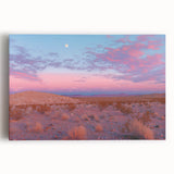 Stretched canvas art depicting a vibrant desert landscape with warm hues of orange and yellow, showcasing dramatic rock formations under a clear blue sky, ideal for home decor.