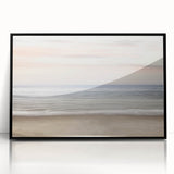 Large abstract wall art in mid-century modernist style, featuring swirling orange and yellow tones, framed in black acrylic.