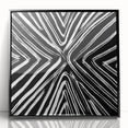 Framed acrylic wall art featuring abstract black strokes on a white background, perfect for modern decor. Ideal for enhancing living spaces or offices.