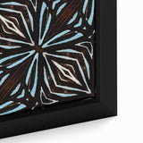Close-up of a framed canvas wall art featuring vibrant abstract strokes in shades of blue, orange, and yellow, perfect for modern home decor.
