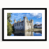 Black-framed landscape artwork with a castle scene, featuring a white mat for enhanced presentation, ideal for home decor or gallery display.
