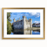 Elegant gold-framed landscape artwork depicting a majestic castle surrounded by lush greenery and a serene sky, perfect for home decor enhancement.