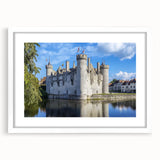 Elegant landscape artwork depicting a grand castle surrounded by lush greenery, framed in white with a textured mat, showcasing a sophisticated front view perfect for home decor.