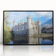 Framed acrylic artwork showcasing a picturesque landscape featuring a majestic castle surrounded by lush greenery, highlighted by a sleek black frame.