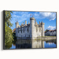 Framed canvas artwork depicting a picturesque landscape with a majestic castle, presented in a sleek black frame, ideal for enhancing home decor.