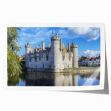 Vibrant rolled print showcasing a scenic landscape with a majestic castle, featuring rich colors and intricate details, perfect for home decor.