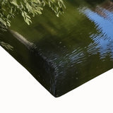 Close-up of a stretched canvas artwork depicting a grand castle landscape with vibrant colors and intricate details, ideal for home decor or art enthusiasts.