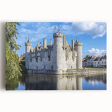 Stretched canvas artwork depicting a serene landscape with a grand castle surrounded by lush greenery, showcasing vibrant colors and intricate details, perfect for home decor.