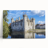 Stretched canvas artwork depicting a serene landscape with a majestic castle surrounded by lush greenery and a tranquil lake, ideal for enhancing home decor.