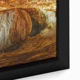 Close-up of a framed canvas artwork showcasing a vibrant landscape scene with intricate cave details, perfect for enhancing home decor and artistic ambiance.