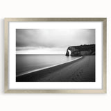 Framed landscape artwork featuring majestic cliffs and serene scenery, elegantly presented with a silver mat, perfect for enhancing home decor.