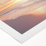Vibrant rolled canvas artwork depicting a serene beach landscape at sunset, showcasing soft pastel colors and gentle waves, perfect for coastal-themed decor.