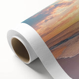 Vibrant rolled canvas artwork showcasing a serene beach landscape with golden sands and turquoise waters, elegantly packaged in a protective cardboard tube for safe shipping.