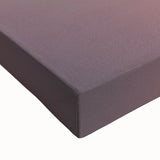 Close-up of a stretched canvas depicting a vibrant beach landscape, showcasing vivid blues and greens, perfect for coastal home decor and relaxation themes.