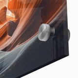 Close-up of a vibrant acrylic landscape artwork showcasing dramatic canyons with rich textures and bold colors, perfect for modern home decor.