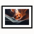 Black-framed landscape art print featuring a stunning canyon scene with rich hues of orange and blue, elegantly matted for a sophisticated display. Perfect for enhancing home decor.