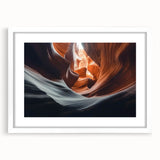 Framed landscape artwork depicting vibrant canyons in rich earth tones, featuring a white mat for a polished presentation, perfect for enhancing home decor.