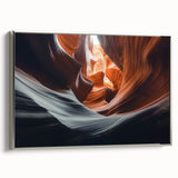 Framed canvas artwork depicting a stunning canyon landscape with rich earth tones and intricate details, featuring a sleek silver frame that enhances its elegance.