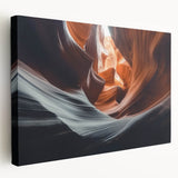 Stretched canvas artwork depicting a vibrant landscape of canyons under a bright blue sky, showcasing rich earthy tones and dramatic rock formations, perfect for home decor.