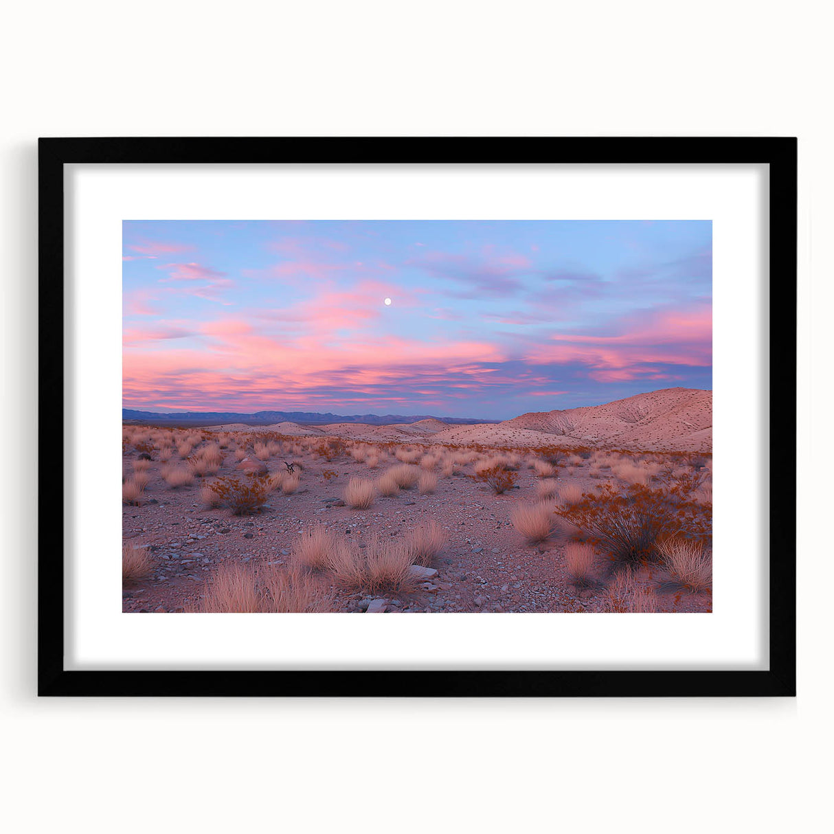 Desert landscape framed artwork in a black frame with a white mat, showcasing vibrant hues of orange and blue, perfect for modern home decor.