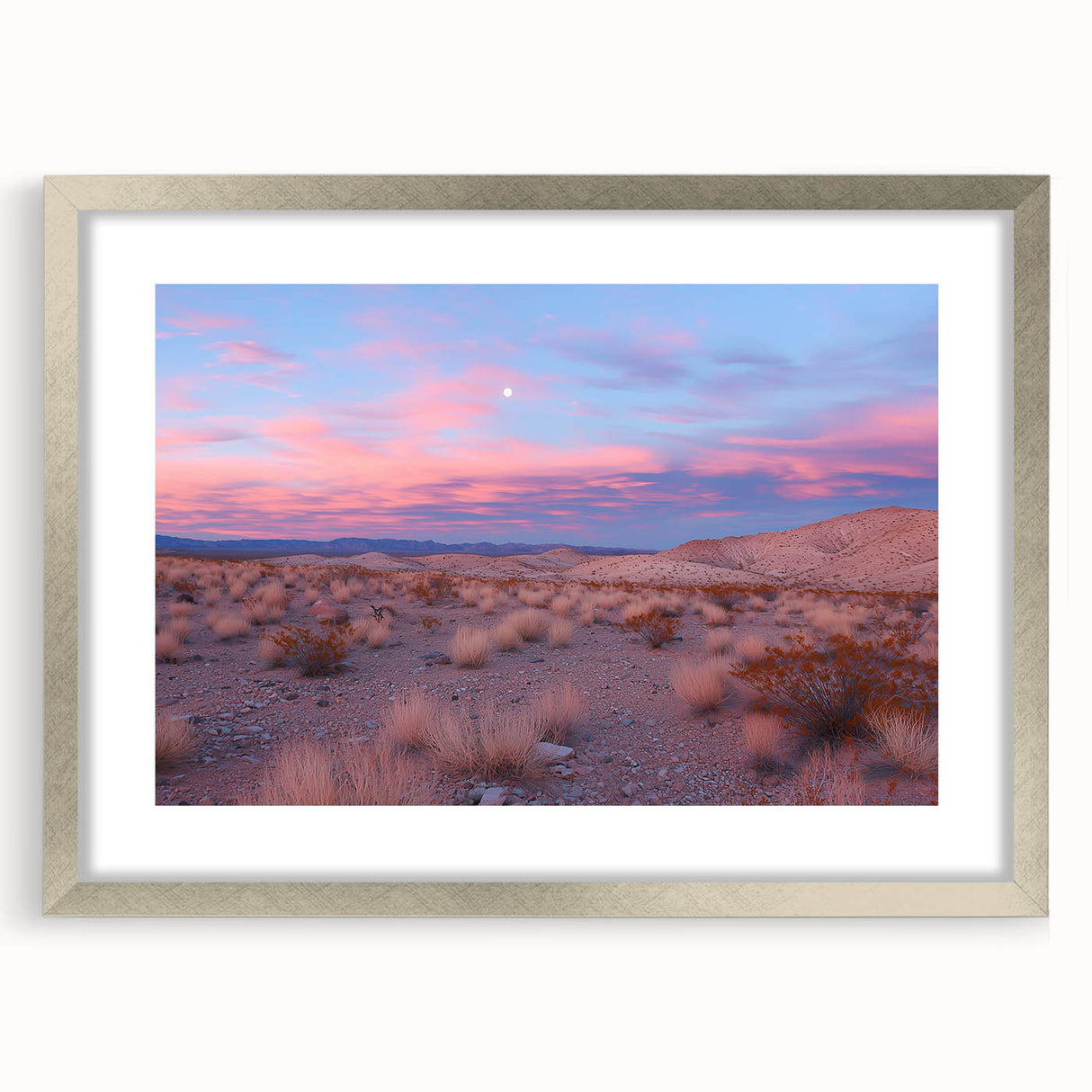Framed desert landscape artwork with a silver mat, showcasing vibrant hues of orange and gold, ideal for modern home decor or office aesthetic.