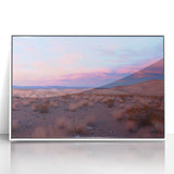 Framed acrylic artwork depicting a vibrant desert landscape, showcasing warm hues of orange and yellow with striking rock formations, perfect for home decor.