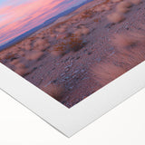 Desert landscape rolled canvas art showcasing warm tones of orange and yellow with intricate details of cacti and mountains, packaged securely in a protective tube.