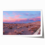 Desert landscape rolled print showcasing vibrant orange and yellow hues, detailed textures, and sweeping dunes, elegantly packaged in a protective tube for shipping.