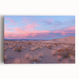 Stretched canvas artwork depicting a serene desert landscape with warm tones of orange and yellow, showcasing rolling dunes and a clear blue sky, ideal for home decor.