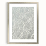 Textured abstract art print in vibrant orange and yellow hues on a silver-framed canvas, ideal for bedroom art.