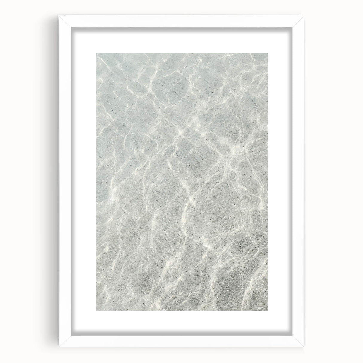 Abstract art print featuring swirling blue and white patterns on a framed white canvas.