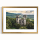 Gold-framed landscape artwork showcasing a majestic castle surrounded by lush greenery, complete with a mat for an elegant presentation. Ideal for home decor.