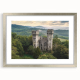 Elegant silver-framed landscape artwork featuring a majestic castle surrounded by lush greenery, complete with a decorative mat for added sophistication, perfect for enhancing home decor.