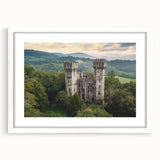 Elegant white-framed landscape artwork showcasing a serene castle scene, complete with a white mat for a polished finish, perfect for home decor or gallery display.