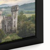 Close-up of a framed canvas featuring a vibrant landscape with a majestic castle, rich colors, and intricate details, adding a touch of elegance to any room decor.