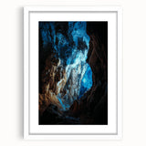 White-framed landscape artwork featuring a serene cave scene, showcasing natural textures and earthy tones, perfect for modern home decor or gallery display.