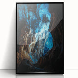 Framed acrylic artwork depicting a stunning landscape with caves, featuring a sleek black frame and clear glass front, ideal for modern home decor.