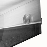 Close-up of a vibrant acrylic landscape painting showcasing dramatic cliffs and blue skies, displayed in a modern glass frame, perfect for home decor.