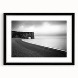 Black-framed landscape artwork depicting dramatic cliffs, displayed in a stylish mat, ideal for home decor or interior design enhancement.