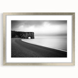 Elegant silver-framed artwork showcasing a breathtaking landscape of cliffs, surrounded by a stylish mat, perfect for enhancing home decor with natural beauty.