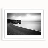 Framed landscape artwork showcasing majestic cliffs and serene natural scenery, presented with a white mat for a clean, elegant look, ideal for home decor.
