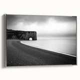 Framed canvas artwork showcasing a stunning landscape with dramatic cliffs and a serene sky, featuring a sleek silver frame that enhances its elegance. Ideal for modern home decor.