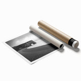 Vibrant landscape print showcasing dramatic cliffs and ocean waves, rolled and packaged in a protective cardboard tube, perfect for wall decor enthusiasts.