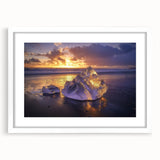 Framed landscape artwork depicting serene beaches with a white mat, showcasing soft blue and sandy tones, perfect for coastal-themed home decor.