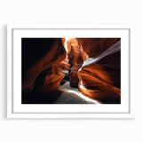 Framed landscape artwork showcasing vibrant canyons in rich earth tones, featuring a white mat border, perfect for enhancing modern home decor aesthetics.