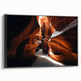 Framed canvas artwork showcasing a stunning landscape of canyons in rich earthy tones, presented in a sleek black frame, perfect for enhancing home decor.